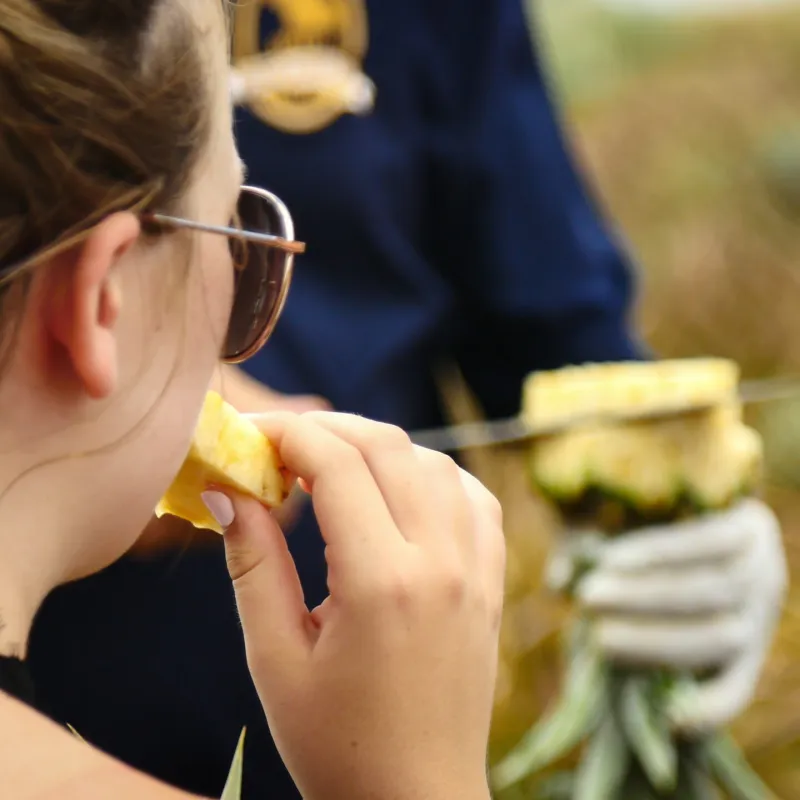 a woman eating a hot dog