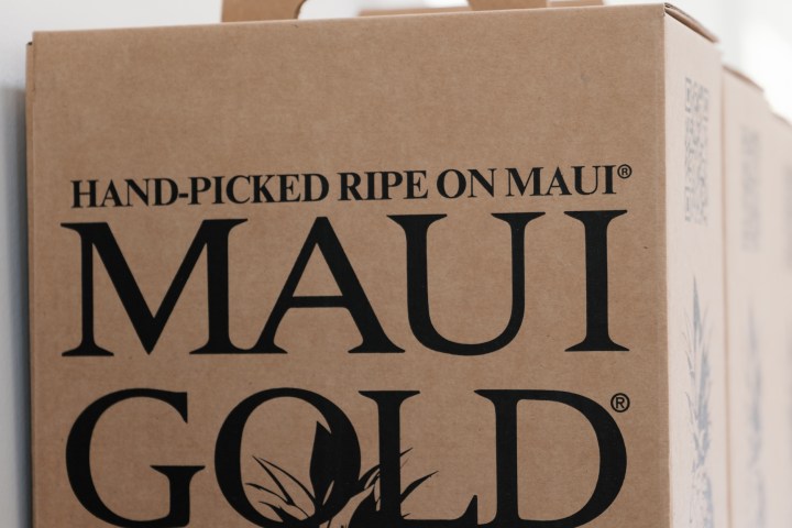 Cardboard box labeled 'Maui Gold' with a handle and pineapple graphic.